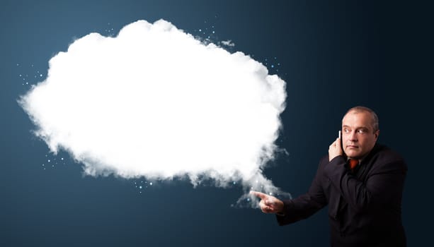 Businessman in suit making phone call and presenting abstract cloud copy space