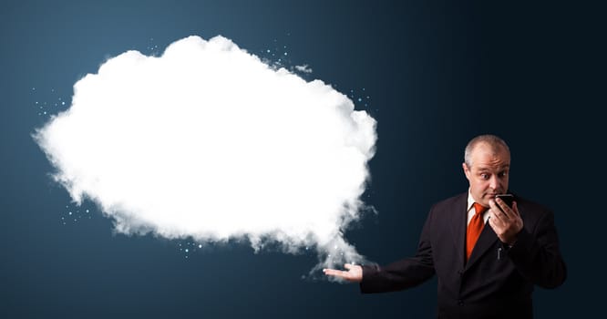 funny businessman in suit holding a phone and presenting abstract cloud copy space