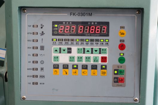 Industrial machine start stop and jog buttons in english and chinese letters