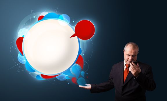 crazy businessman in suite holding a phone and presenting abstract modern speech bubble with copy space