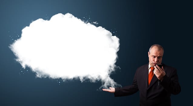 funny businessman in suit holding a phone and presenting abstract cloud copy space