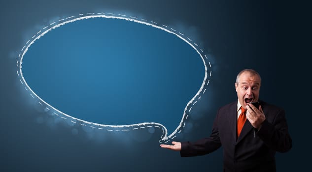 funny businessman in suit holding a phone and presenting speech bubble copy space