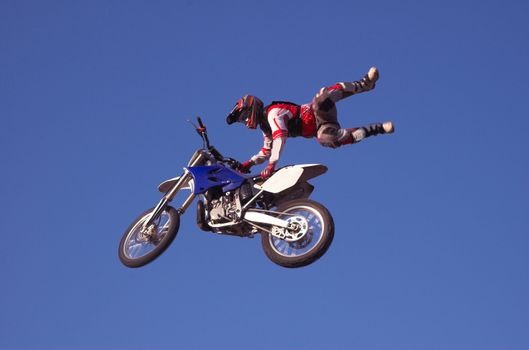 Moto X Freestyle rider high in sky