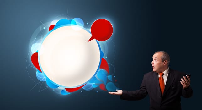 crazy businessman in suite holding a phone and presenting abstract modern speech bubble with copy space
