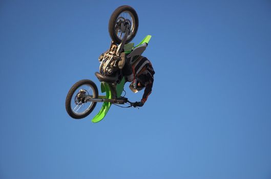 Moto X Freestyle rider radically vertical in sky