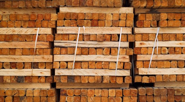 Stacked wood or timber in factory warehouse or storage area