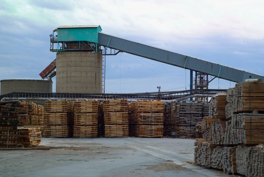 Timber industrial wood factory industry image with plant tower in background