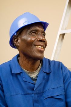 African American Construction Worker, Handyman, Carpenter, Resting on Ladder Steps