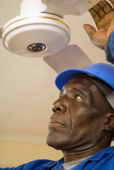 African American Construction Worker, Handyman, Carpenter, Electrician, Fixing Ceiling Fan