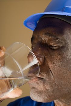 Tired Construction Worker Drinking Water