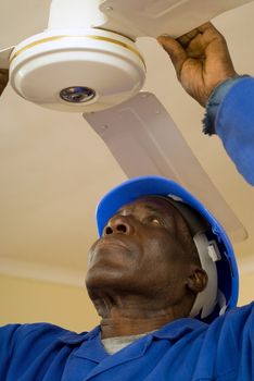 African American Construction Worker, Handyman, Carpenter, Electrician, Fixing Ceiling Fan