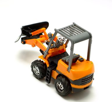 Small model bulldozer on white