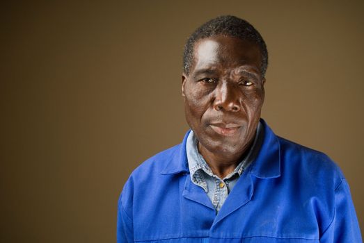 South African or American black senior worker or blue collar foreman portrait
