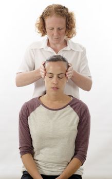 Kinesiologist or physiotherapist treating Neuro vascular holding - emotional stress release