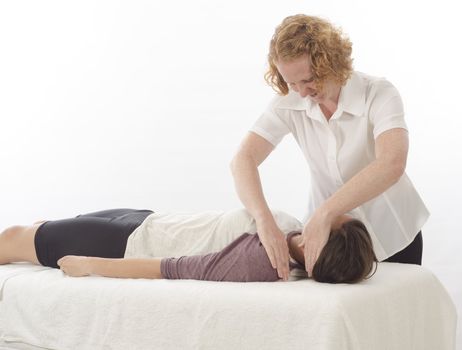 Kinesiologist or physiotherapist treating Upper trapesius