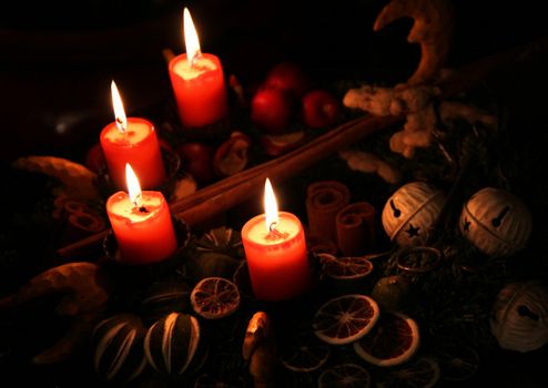 Traditional Christmas wreath and burning candles