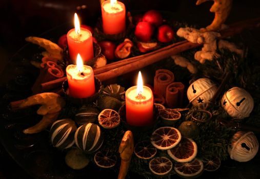 Traditional Christmas wreath and burning candles