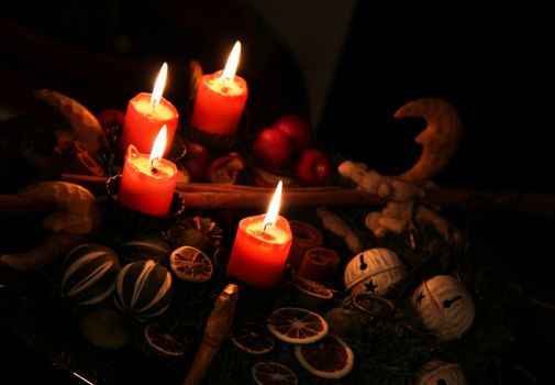 Traditional Christmas wreath and burning candles