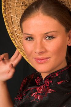 Western model in traditional eastern Chinese or Japanese clothing and hat