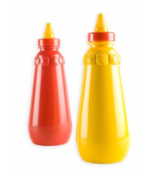 Mustard and tomato ketchup bottles - selective focus on mustard bottle