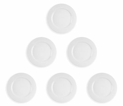 Image composite of five clean white dinner plates in a pyramid