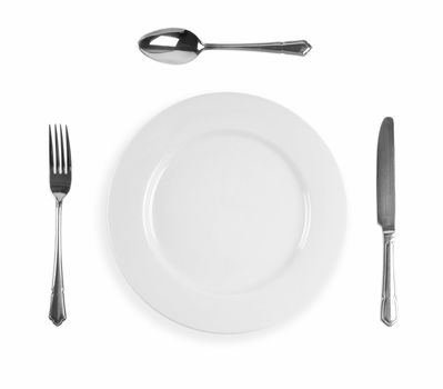 Cutlery dinner setting with knife,  fork, spoon and plate