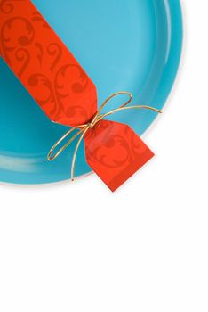 Christmas or party cracker on green dinner plate