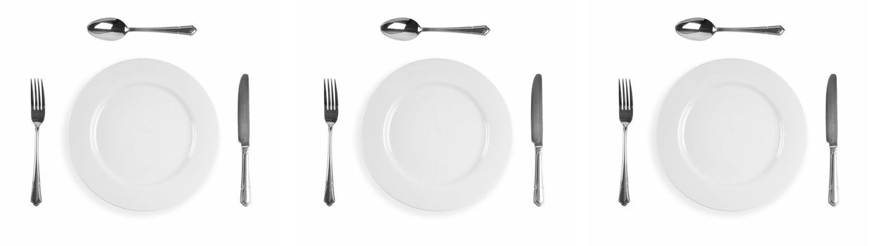 Image composite of three plate cuterly setting with knife, fork, plate and spoon