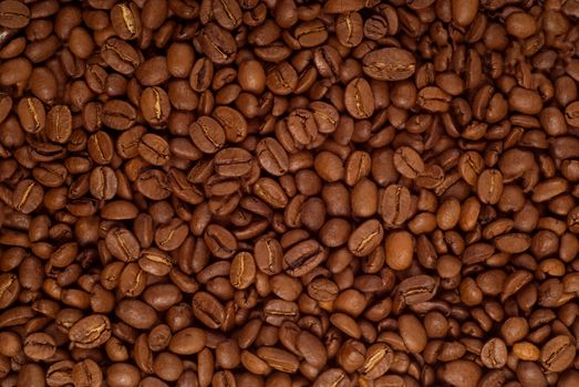 Roasted brown coffee beans as a background