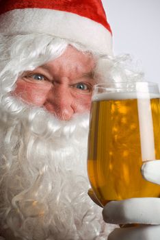 Father Christmas Santa looks at a lovely glass of beer