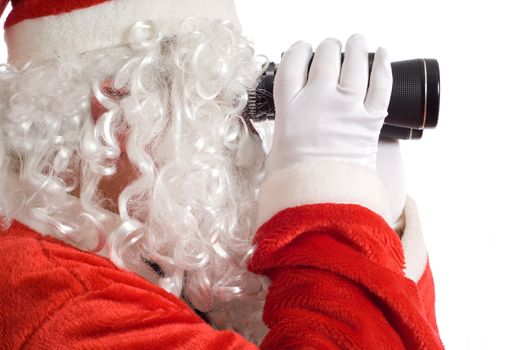 Close up of Father Christmas looking at the future business strategy with binoculars to the right