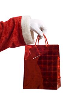 Father Christmas hand holding a red present on white
