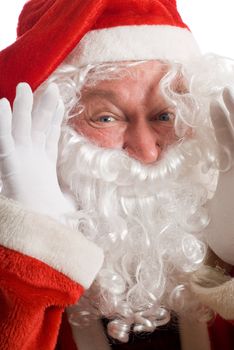 Father Christmas shouting something with hands at side of beard and mouth