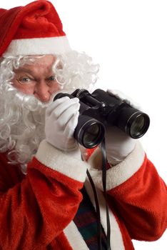 Isolated Father Christmas with a jolly look in his eye and binoculars