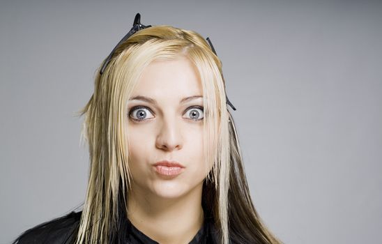 Client with wet hair surprised by haircut