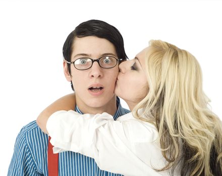 Nerd business man surprised by kiss from pretty valentine girl isolated on white