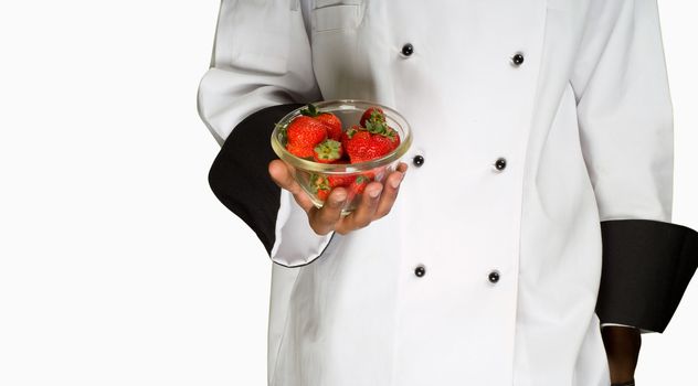 South African or American chef with strawberries in bowl