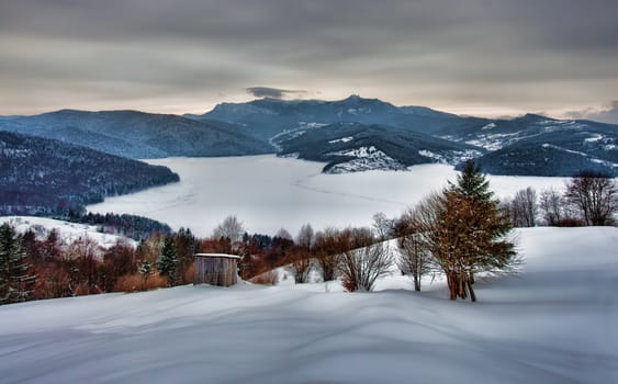 traditional winter village landscape in Romania Carpathians