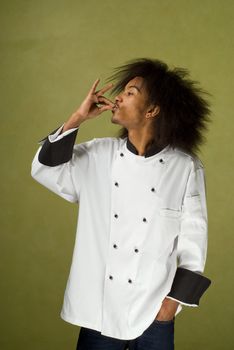 Young Chef Using Hands in Motion to Symbolise Perfection