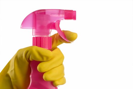 Pink cleaning bottle with janintor or housewife hand in yellow glove