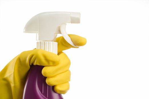 Lavender or purple cleaning bottle with janintor or housewife hand in yellow glove