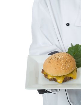 Chef or waiter in uniform serving cheeseburger
