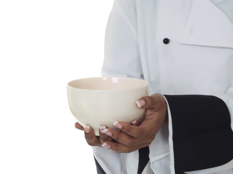 Chef hands and jacket holding or serving empty soup bowl isolated on white