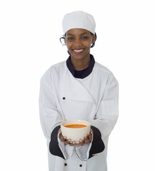 Professional chef in workwear jacket serving soup isoltated on white