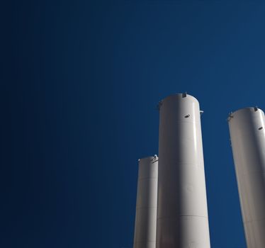 Industrial storage gas tank on blue sky