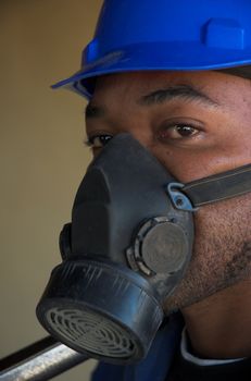 Construction worker plumber with safety dust mask over mouth