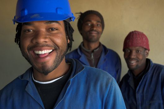 Three smiling building, plumbing contruction wokers