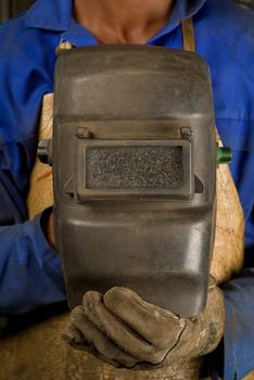 South African or black American welder worker with mask
