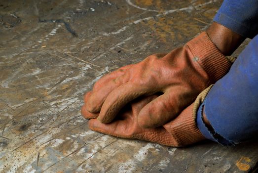 Blue collar worker hands in protective gloves