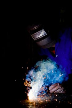 South African or American black worker welding